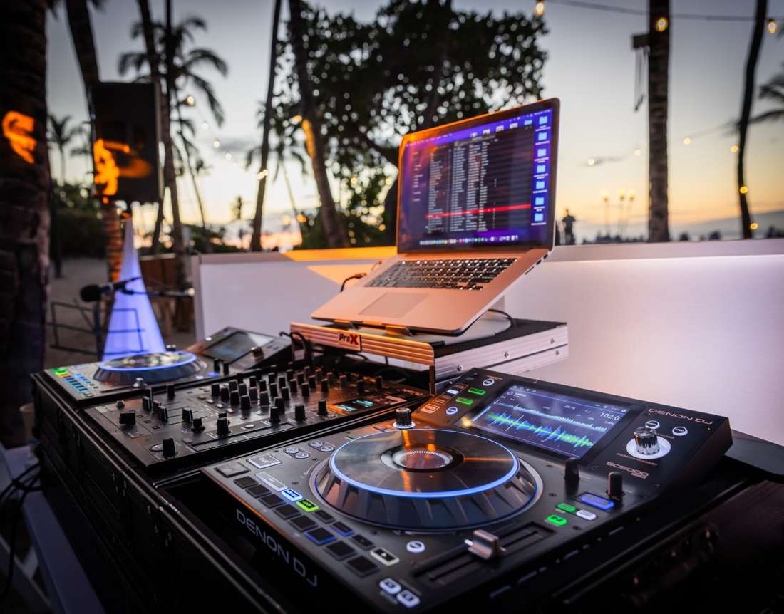 DJ decks overlooking an outdoor reception