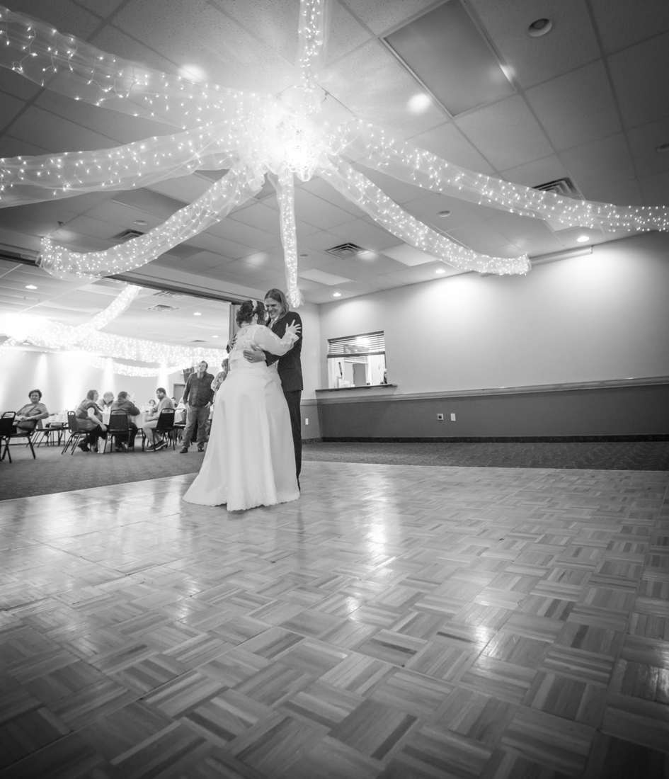 Reception dance floor beneath overhead lights